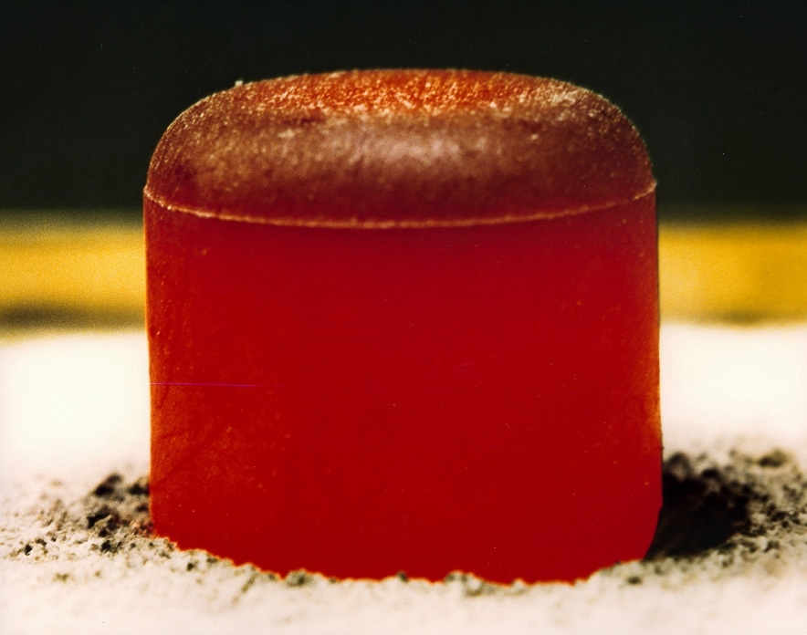 A plutonium-238 dioxide pellet — it's glowing red-hot