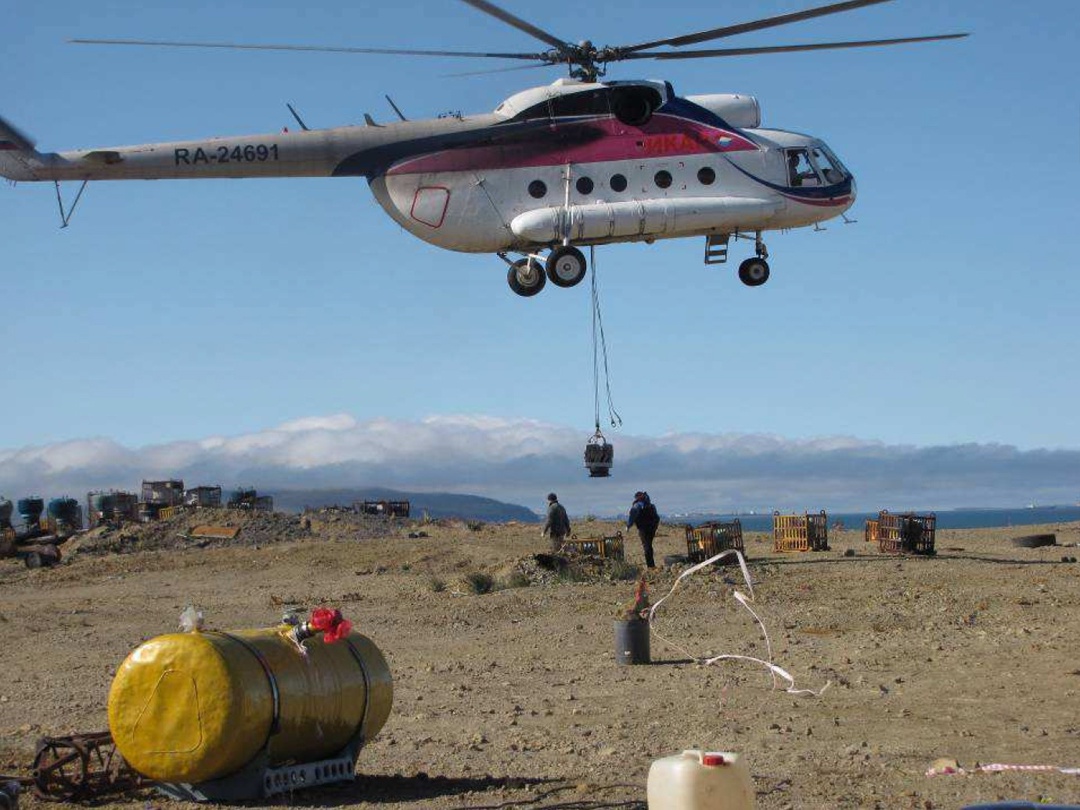 Transporting recovered RTGs by helicopter. Chukotka, near the city of Pevek